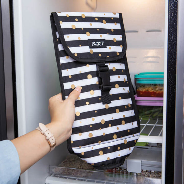PackIt’s freezable wine cooler bag being placed in a freezer
