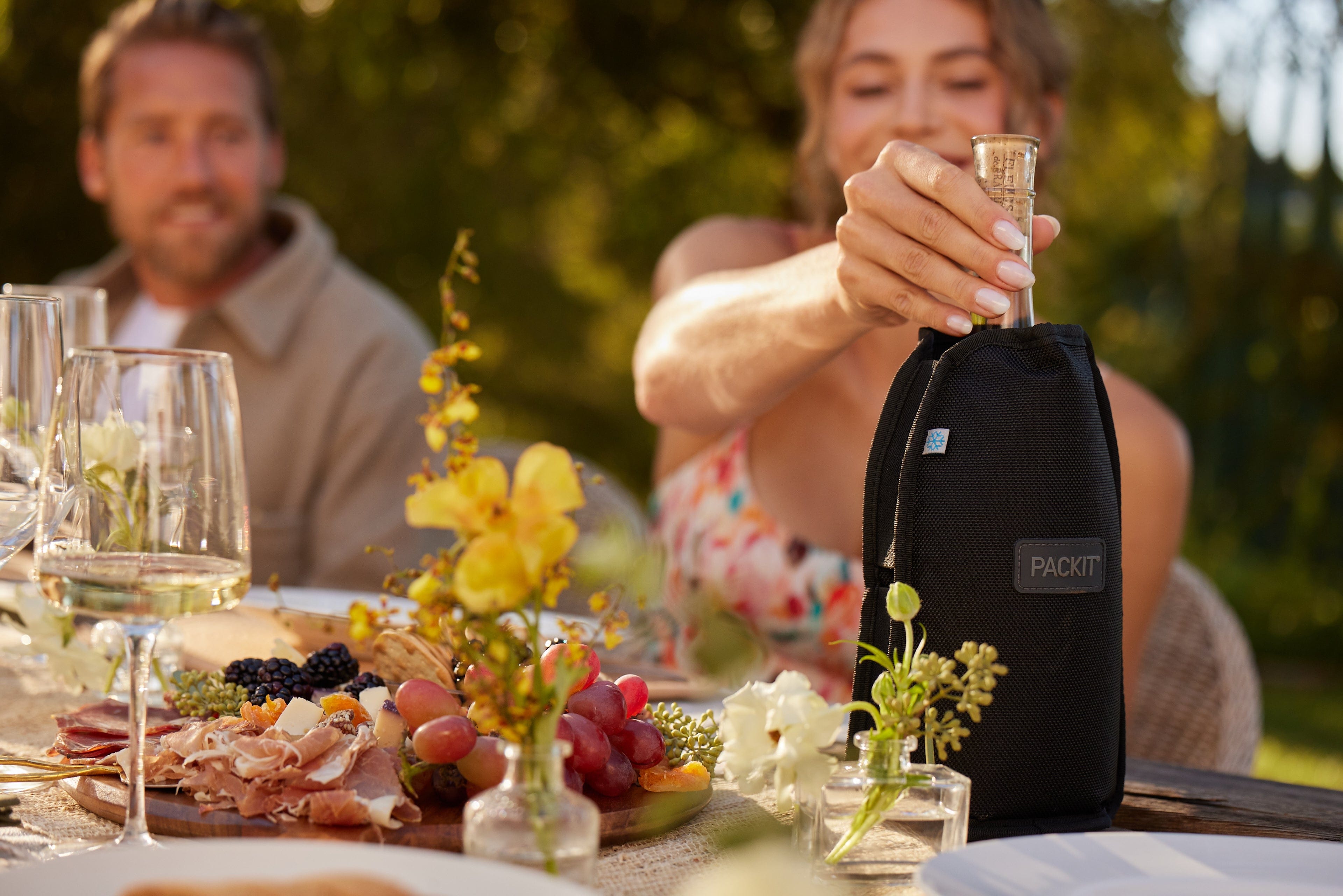 freezable-wine-cooler-black-lifestyle-outdoor-dinner-on-table.jpg